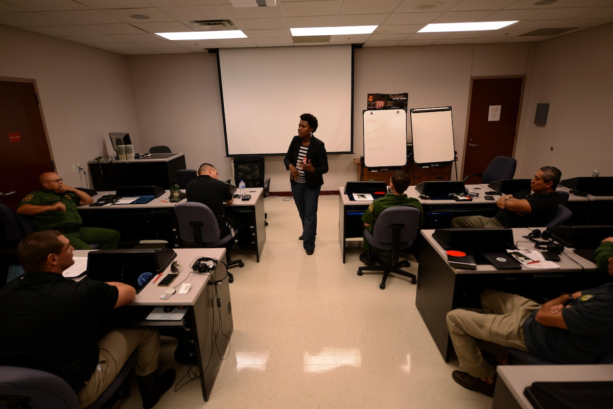 Aliyah Negley, 47th Flying Training Wing community support coordinator, instructs a class on suicide prevention at the U.S. Customs and Border Protection Del Rio Border Patrol Sector in Del Rio, Texas, Sept. 21, 2015. The training covered the pillars of resiliency, ways to cope with stress, how to overcome overwhelming challenges, and how to look for the signs of depression or suicidal thoughts. (U.S. Air Force photo by Airman 1st Class Ariel D. Partlow) (Released)
