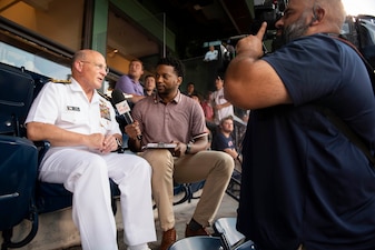 Chief of Naval Operations Adm. Mike Gilday speaks in an interview with Northeast Sports Network during a Red Sox baseball game at Fenway Park, Boston.