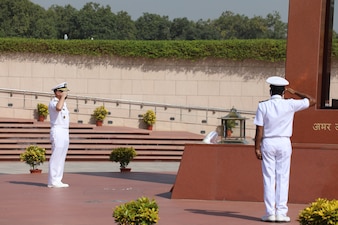 NEW DELHI (Oct. 12, 2021) Chief of Naval Operations (CNO) Adm. Mike Gilday, left, salutes during a wreath laying ceremony at the National War Memorial in New Delhi. Gilday is in India to meet with India Chief of Naval Staff Admiral Karambir Singh and other senior leaders from the Indian Navy and government. (Photo courtesy of U.S. State Department/Released)