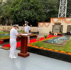VISAKHAPATNAM, India (Oct. 13, 2021) Chief of Naval Operations (CNO) Adm. Mike Gilday, left, signs a memento during a visit to the lost-at-sea memorial at the Indian Eastern Naval Command Headquarters. Gilday is in India to meet with India Chief of Naval Staff Admiral Karambir Singh and other senior leaders from the Indian Navy and government.  (U.S. Navy photo by Cmdr. Nate Christensen/Released)