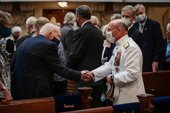 ANNAPOLIS, Md. (Sept. 20, 2021) Chief of Naval Operations (CNO) Adm. Mike Gilday, right, greets attendees at a memorial service for the 23rd CNO, Adm. Carlisle Trost, at the U.S. Naval Academy. Trost was the CNO from 1986 to 1990. (U.S. Navy photo by Mass Communication Specialist 1st Class Sean Castellano/Released)