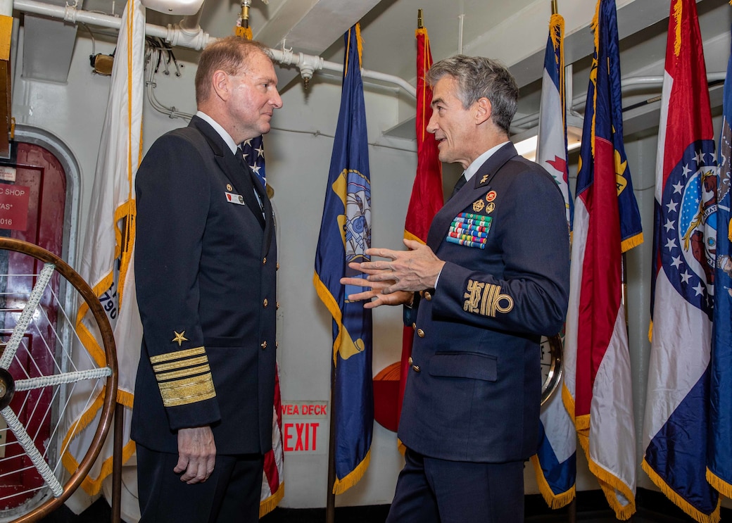 Adm. Stuart Munsch, commander, U.S. Naval Forces, Africa, commander, Allied Joint Forces Command, Naples, talks with Italian Navy Fleet Commander Vice Adm. Aurelio De Carolis , during a reception for local military and civilian leaders honoring the U.S.–Italian relationship, aboard the Nimitz-class aircraft carrier USS George H.W. Bush (CVN 77) while anchored in the Bay of Naples, Nov. 29, 2022.