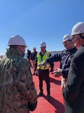 GROTON, Conn. (Feb. 28, 2022) Chief of Naval Operations (CNO) Adm. Mike Gilday, left, and Connecticut Rep. Joe Courtney, right, conduct a visit to the Electric Boat Shipyard, in Groton, Connecticut. (U.S. Navy photo by Cmdr. Courtney Hillson/Released)