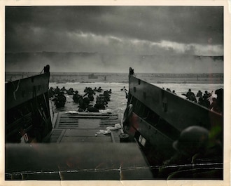 "The Jaws of Death" - An official U.S. Coast Guard photograph by CPHOM Robert F. Sargent, USCG. A Coast Guard-manned LCVP from the U.S.S. Samuel Chase disembarks troops of the First Division on the morning of 6 June 1944 at Omaha Beach. Click on this iconic image to learn more about the CG's historic role at Normandy.