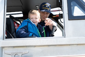 BM3 Andrew Oats and a student from LEARN DC take a break for a picture while touring a 29’ Response Boat-Small at Joint Base Anacostia-Bolling in Washington D.C. on April 27th, 2022.