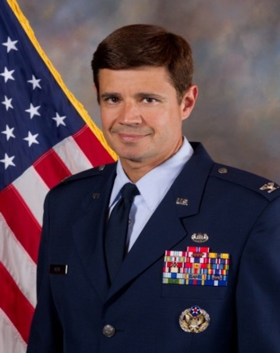 Photo of Colonel Eric Mejia posing for an official photo.