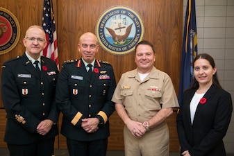 Canadian Armed Forces personnel and Chief of Naval Personnel Vice Adm. Rick Cheeseman pose for a photo