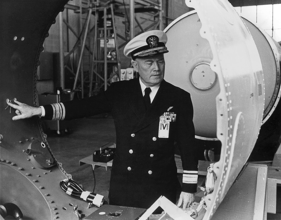 Rear Adm. William F. Raborn, appointed the first director of the Navy Special Projects Office (SPO) in Dec. 1955, examines the components of a Polaris test vehicle. The SPO was established by the Secretary of the Navy and was responsible for development and testing of world's first submarine-launched ballistic missile (SLBM) and its related systems in conjunction with industry partners.