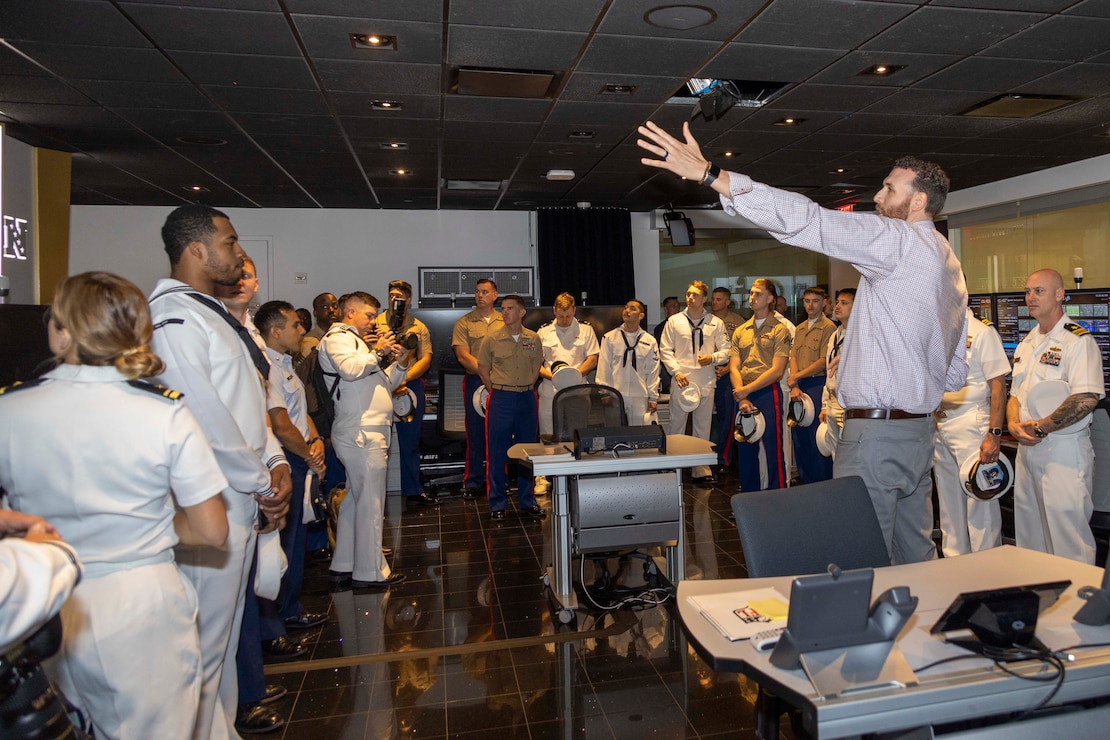 Mr. Frank Azczepanik, National Football League (NFL) Game Day replay supervisor, tours the NFL replay room with U.S. Marines, Sailors and Coast Guardsmen as part of a tour of the NFL Headquarters for Fleet Week New York (FWNY), May 25, 2023. During FWNY 2023, more than 3,000 service members from the Marine Corps, Navy and Coast Guard and our NATO allies from Great Britain, Italy and Canada are engaging in special events throughout New York City and the surrounding Tri-State Region, showcasing the latest capabilities of today’s maritime services and connecting with citizens. These events include free public ship tours, military static displays, and live band performances and parades. (Photo by Mass Communication Specialist 1st Class Pedro A. Rodriguez)