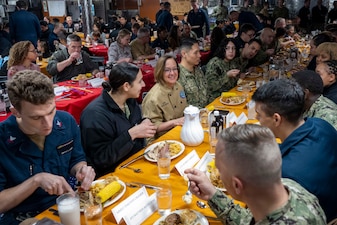 YOKOSUKA, Japan (Nov. 23, 2023) – Chief of Naval Operations Adm. Lisa Franchetti eats Thanksgiving dinner with Sailors aboard the U.S. Navy's only forward-deployed aircraft carrier USS Ronald Reagan (CVN 76), Nov. 23. Franchetti and Master Chief Petty Officer of the Navy James Honea visited Reagan and other 7th Fleet commands to engage with Sailors and Navy leadership to highlight Franchetti's priority of strengthening the Navy team. (U.S. Navy photo by Chief Mass Communication Specialist Amanda R. Gray)