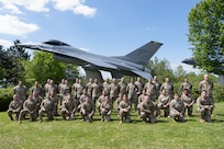 U.S. Airmen with the 156th Wing, Puerto Rico Air National Guard, pose for a group photo at Spangdahlem Air Base, Germany, May 9, 2024. The 156th LRS integrated with the 52nd LRS as a force multiplier, assisting with daily operations and augmenting capabilities in support of the 52nd Fighter Wing Saber Knight Readiness Exercise 24-01.