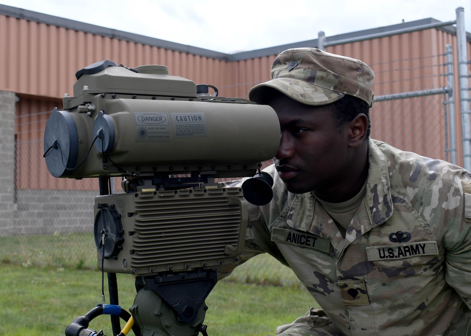 U.S. Army Spc. Jeffrey Anicet, a joint fire support specialist with the New York National Guard's 1st Battalion, 258th Field Artillery Regiment, operates a lightweight laser designator rangefinder in Fort Drum, N.Y., June 27, 2024.