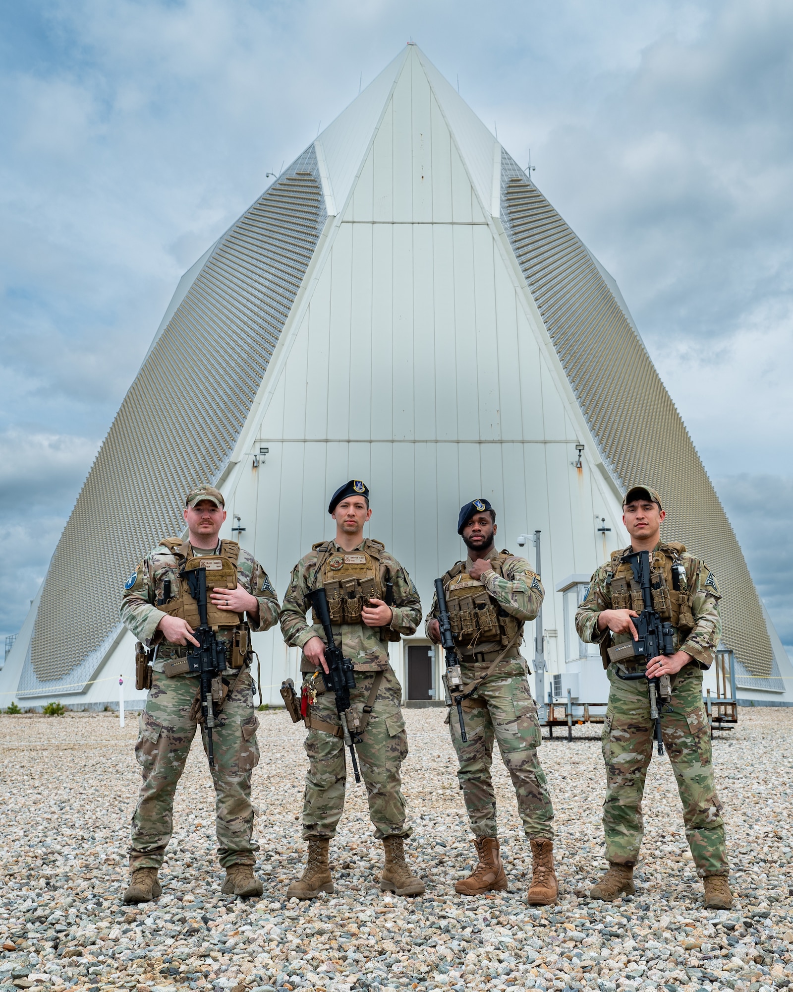 Air Force defenders pose in front of Space Force radar facility