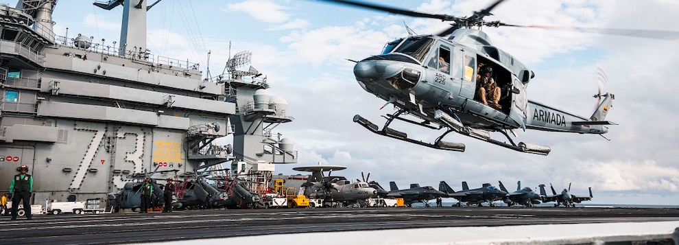 A Colombian navy Bell 412 helicopter takes off from the flight deck of Nimitz-class aircraft carrier USS George Washington (CVN 73) while underway in the Pacific Ocean.