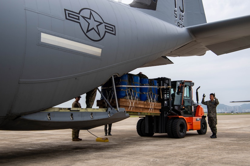 A member of the Republic of Korea Air Force loads container delivery system bundles onto a C-130J Super Hercules assigned to the 36th Airlift Squadron in preparation for an airdrop training event at Gimhae Air Base, Republic of Korea.
