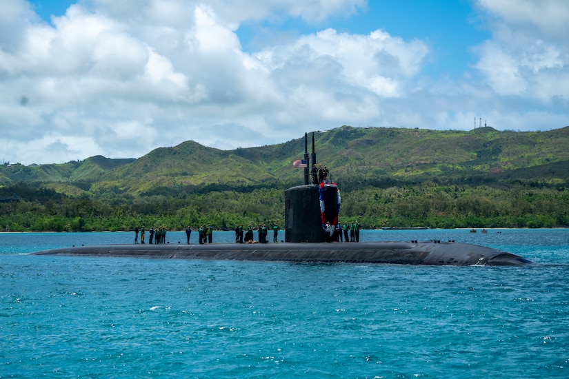 A submarine transits a body of water.
