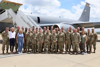 Airmen and Soldiers from the Tennessee National Guard pose in front of the KC-135 Stratotanker crewed by Arizona National Guard's 161st Air Refueling Wing before departing Nashville for Sofia, Bulgaria, June 28, 2024, to support U.S. European Command’s U.S. Independence Day celebrations. The 129th Army National Guard Band, supplemented by former members of the 572nd Air National Guard Band, performed at the event.