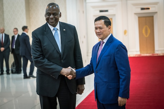 Secretary of Defense Lloyd J. Austin III greets Cambodian Prime Minister Hun Manet  during a visit to senior Cambodian government officials in Phnom Penh.