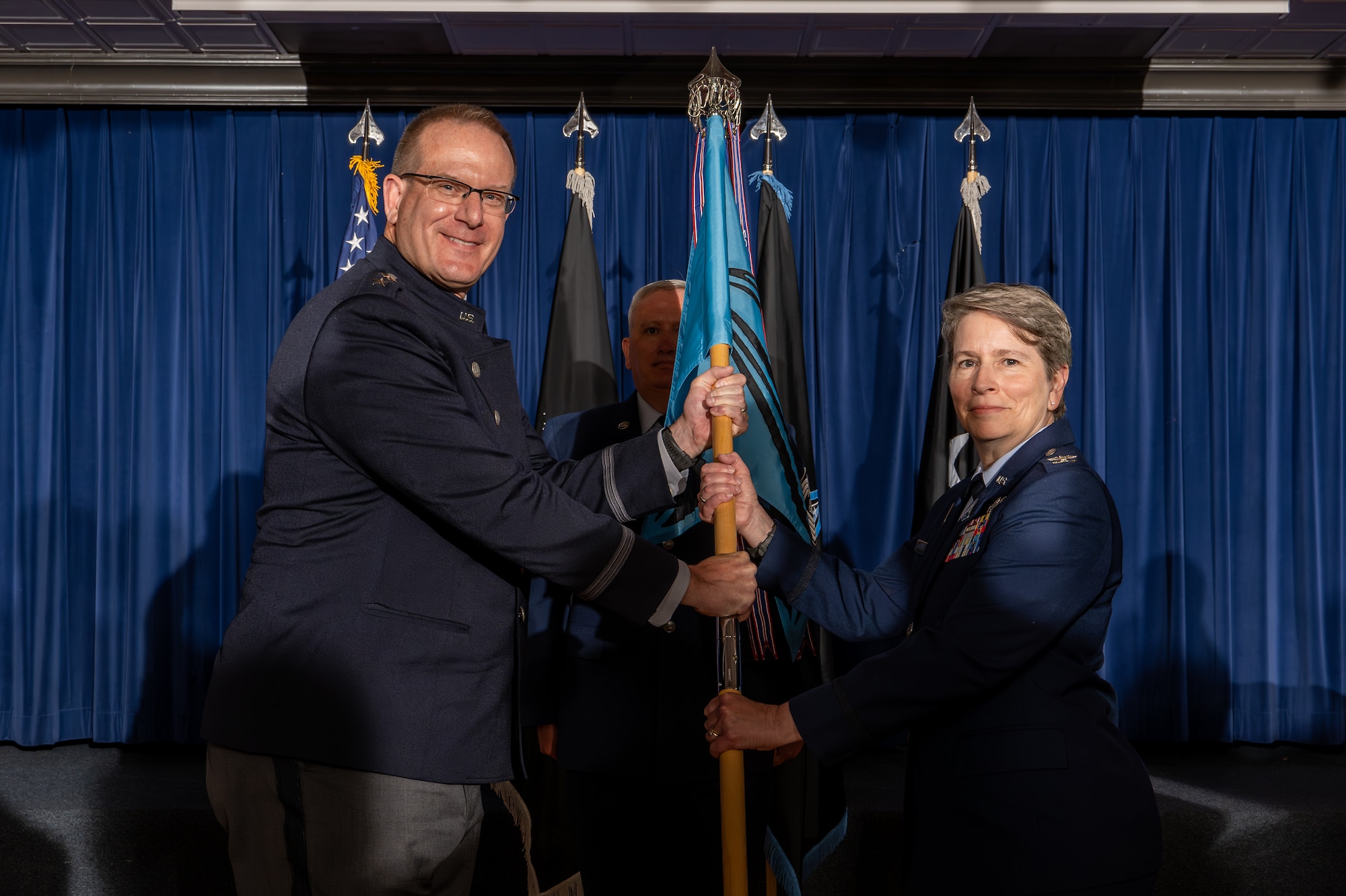 U.S. Space Force Col. Sacha Tomlinson, Space Delta 12 incoming commander, right, assumes command of Delta 12 during a change of command ceremony at  Peterson Space Force Base, Colorado, May 31, 2024. As the commander of Delta 12, Tomlinson leads the integrated test and evaluation of U.S. Space Force capabilities to rapidly field combat-credible weapon systems and tactics. (U.S. Space Force photo by Dalton Prejeant)