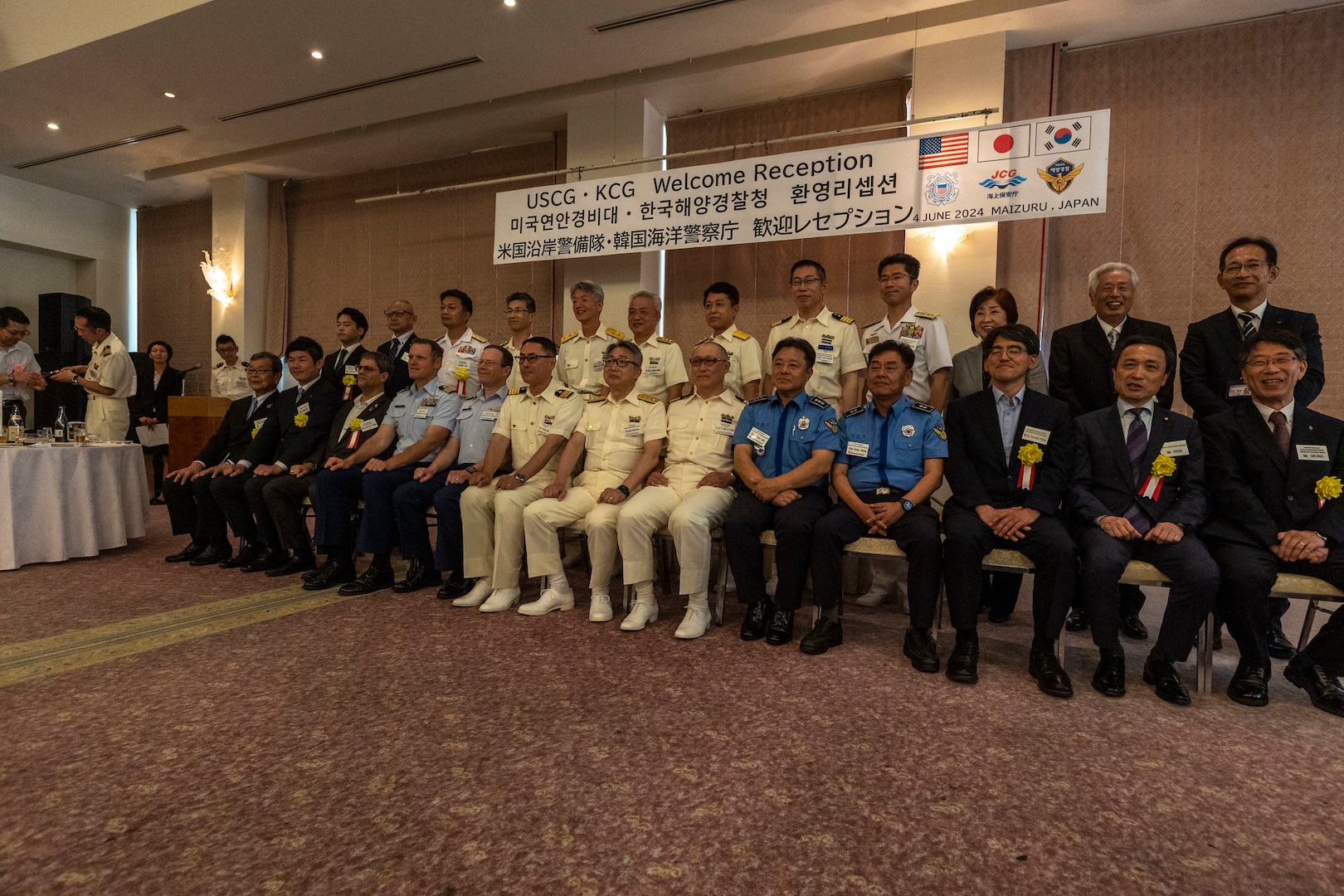 Leadership from the U.S. Coast Guard Cutter Waesche (WMSL-751), Republic of Korea Coast Guard, Japanese Coast Guard, and members from the Maizuru City council pose for a photo during a reception ceremony in Maizuru, Japan, June 5, 2024. The reception was held to commemorate the first trilateral training between the United States, Japanese and Republic of Korea Coast Guards. The U.S. Coast Guard has operated in the Indo-Pacific for more than 150 years, and the service is increasing efforts through targeted patrols with our National Security Cutters, Fast Response Cutters and other activities in support of Coast Guard missions to enhance our partnership. (U.S. Marine Corps photo by Cpl. Elijah Murphy)