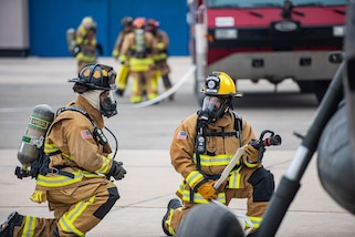 U.S. Air Force firefighters simulate putting out an aircraft fire for a fire rescue evacuation training during Resolute Sentinel 2024 in Lima, Peru, June 3, 2024. One of RS24's goals is to prepare the U.S. and partnered nations to effectively give proper aid during emergency responses with limited resources. (U.S. Air force photo by Airman 1st Class Sir Wyrick)