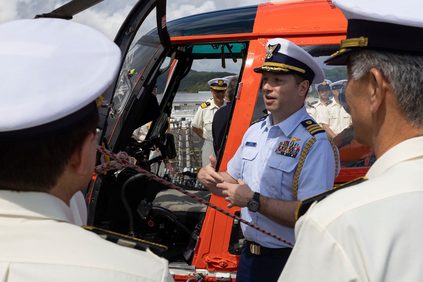 U.S. Coast Guard Cmdr. Jeff Owens, Coast Guard attaché to Japan, explains the airlift capabilities of the Waesche to members of the Japan Coast Guard during a ship tour in Maizuru, Japan, June 5, 2024. Members of the Japan and Republic of Korea Coast Guards toured the Waesche to see the capabilities the U.S. Coast Guard has to handle its mission sets. The U.S. Coast Guard has operated in the Indo-Pacific for more than 150 years, and the service is increasing efforts through targeted patrols with our National Security Cutters, Fast Response Cutters and other activities in support of Coast Guard missions to enhance our partnership. (U.S. Marine Corps photo by Cpl. Elijah Murphy)