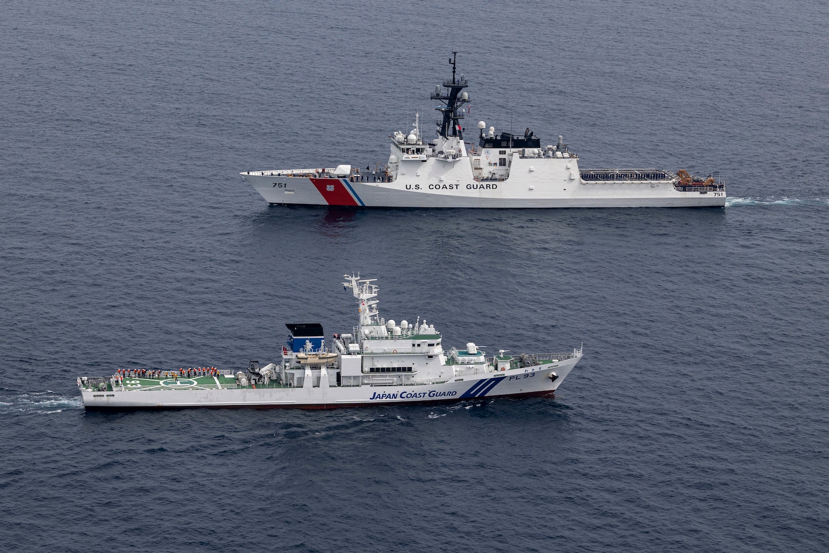 U.S. Coast Guard Cutter Waesche (WMSL-751) and Japan Coast Guard vessel JCGC Wakasa (PL-93) pass during a trilateral search and rescue exercise in the East Sea, June 6, 2024. Coast Guardsmen from Japan, Republic of Korea and the United States used the trilateral exercise as an opportunity to rehearse cohesion between the nations when operating together. The U.S. Coast Guard has operated in the Indo-Pacific for more than 150 years, and the service is increasing efforts through targeted patrols with our National Security Cutters, Fast Response Cutters and other activities in support of Coast Guard missions to enhance our partnership. (U.S. Marine Corps photo by Cpl. Elijah Murphy)