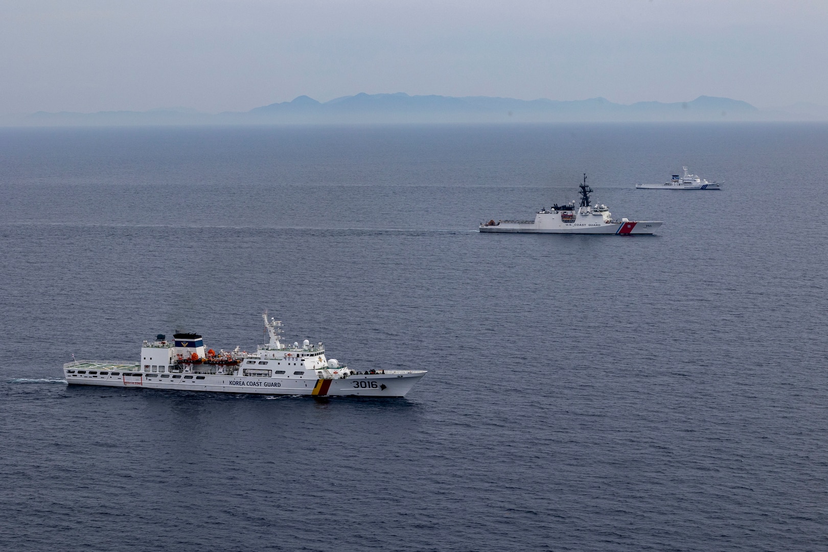 Republic of Korea Coast Guard vessel KCG Taepyongyang (KCG-3016), U.S. Coast Guard Cutter Waesche (WMSL-751) and Japan Coast Guard vessel JCGC Wakasa (PL-93) patrol in formation during a trilateral exercise in the East Sea, June 6, 2024. Coast Guardsmen from Japan, Republic of Korea and the United States used the trilateral exercise as an opportunity to rehearse cohesion between the nations when operating together. U.S. Coast Guard missions in the Indo-Pacific focus on issues directly supporting and advancing our regional partners’ efforts to protect fish stocks, ensure safety of life at sea, support environmental response, and provide disaster relief. (U.S. Marine Corps photo by Cpl. Elijah Murphy