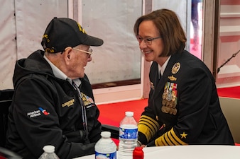NORMANDY, France – Chief of Naval Operations Adm. Lisa Franchetti meets Clarence Holland, a World War II survivor, during the 80th Anniversary of D-Day Ceremony at the Normandy American Cemetery in Normandy, France, June 6, 2024. This ceremony marked the 80th anniversary of the D-Day landings along the Normandy coast during World War II, which ultimately led to the liberation of Europe. (U.S. Navy photo by Chief Mass Communication Specialist Amanda Gray)