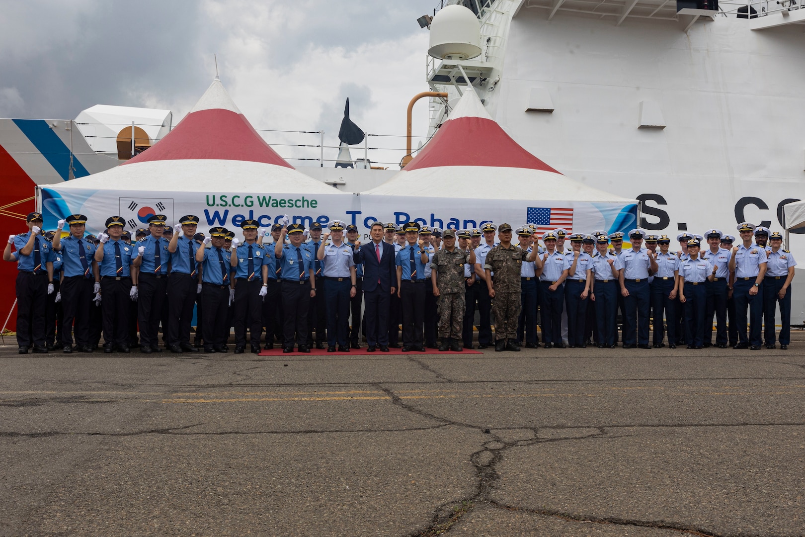 U.S. Coast Guardsmen assigned to the U.S. Coast Guard Cutter Waesche (WMSL-751), members of the Korea Coast Guard, and Lee Kang-Deok, center, mayor of Pohang, pose for a photo during a welcoming reception in Pohang, Republic of Korea, June 9, 2024. U.S. Coast Guardsmen assigned to the Waesche were greeted by members of the Korea Coast Guard upon their arrival to Pohang. Waesche is the second U.S. Coast Guard National Security Cutter deployed to the Indo-Pacific in 2024. Waesche is assigned to Destroyer Squadron (DESRON) 15, the Navy’s largest DESRON and the U.S. 7th Fleet’s principal surface force. Coast Guard cutters routinely deploy to the region to engage with partner nations to ensure a free and open Indo-Pacific. (U.S. Marine Corps photo by Cpl. Elijah Murphy)