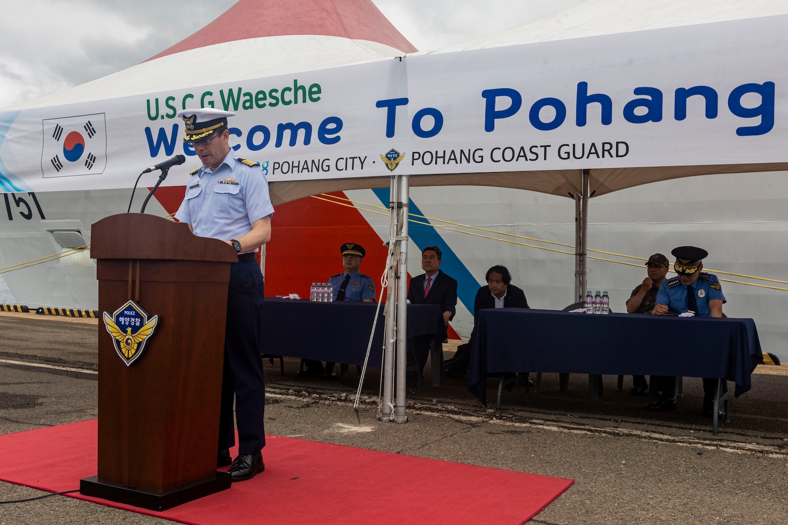 U.S. Coast Guard Capt. Tyson Scofield, commanding officer of the U.S. Coast Guard Cutter Waesche (WMSL-751), gives a speech during a welcoming reception in Pohang, Republic of Korea, June 9, 2024. The Waesche’s arrival marked the first visit by a U.S. Coast Guard ship to Pohang, which was marked with an opening ceremony between United States and Korea Coast Guardsmen. Waesche is the second U.S. Coast Guard National Security Cutter deployed to the Indo-Pacific in 2024. Waesche is assigned to Destroyer Squadron (DESRON) 15, the Navy’s largest DESRON and the U.S. 7th Fleet’s principal surface force. Coast Guard cutters routinely deploy to the region to engage with partner nations to ensure a free and open Indo-Pacific. (U.S. Marine Corps photo by Cpl. Elijah Murphy)