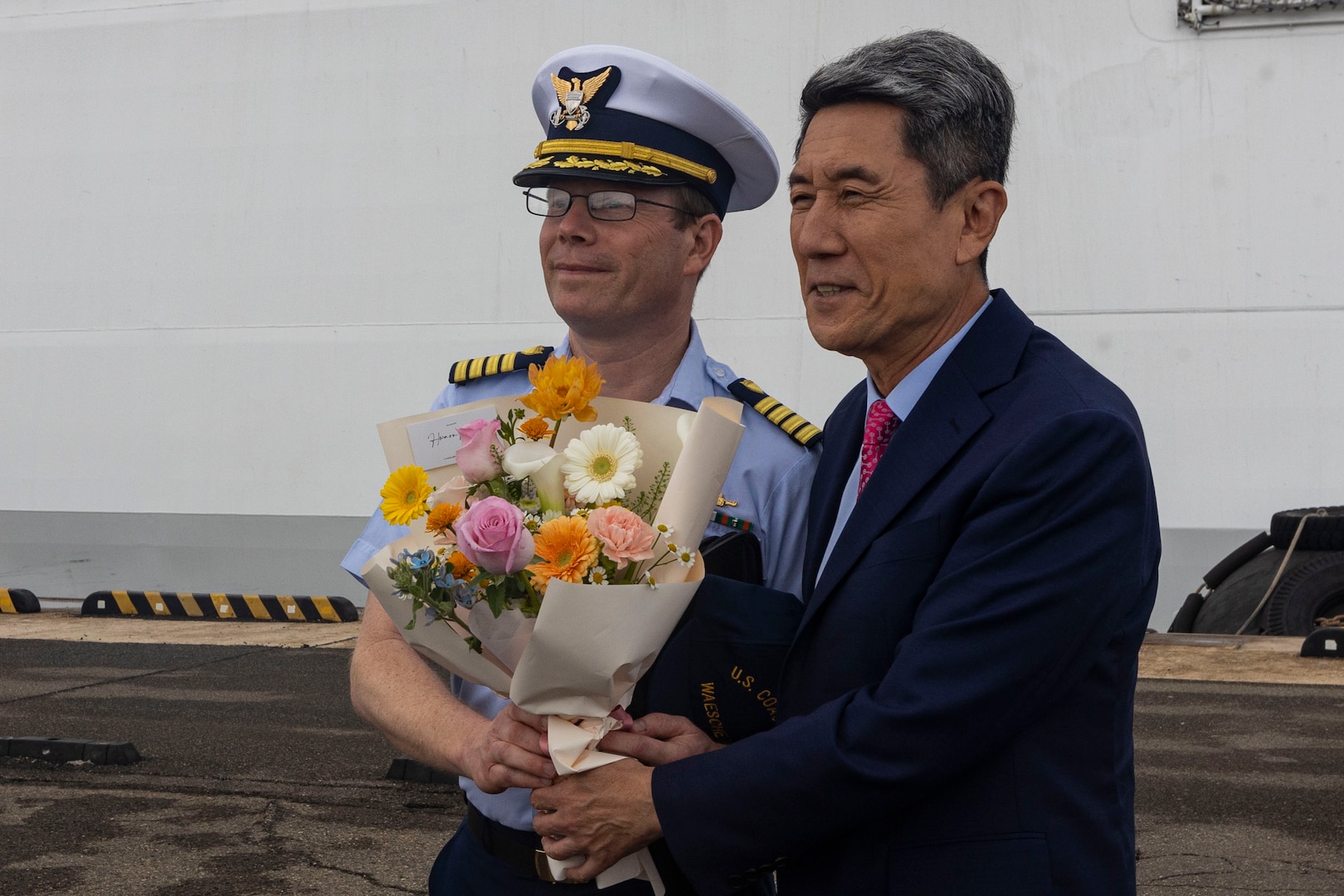 U.S. Coast Guard Capt. Tyson Scofield, the commanding officer of the U.S. Coast Guard Cutter Waesche (WMSL-751), receives a gift from Lee Kang-Deok, the mayor of Pohang, Republic of Korea, during welcoming reception in Pohang, Republic of Korea, June 9, 2024. U.S. Coast Guardsmen assigned to the Waesche were greeted by members of the Korea Coast Guard upon their arrival to Pohang. The U.S. Coast Guard has operated in the Indo-Pacific for more than 150 years, and the service is increasing efforts through targeted patrols with our National Security Cutters, Fast Response Cutters and other activities in support of Coast Guard missions to enhance our partnership. (U.S. Marine Corps photo by Cpl. Elijah Murphy)