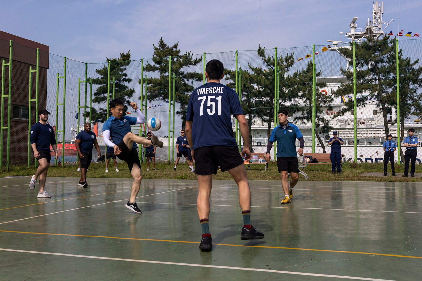 A member of the Republic of Korea Coast Guard kicks the ball during a game of jokgu for a sports day between Korea Coast Guardsmen and U.S. Coast Guardsmen assigned to the U.S. Coast Guard Cutter Waesche (WMSL-751), in Pohang, Republic of Korea, June 10, 2024. United States and Korea Coast Guardsmen came together to play jokgu to build stronger relationship and cooperation between the servicemembers of each nation. Waesche is the second U.S. Coast Guard National Security Cutter deployed to the Indo-Pacific in 2024. Coast Guard cutters routinely deploy to the region to engage with partner nations to ensure a free and open Indo-Pacific. (U.S. Marine Corps photo by Cpl. Elijah Murphy)
