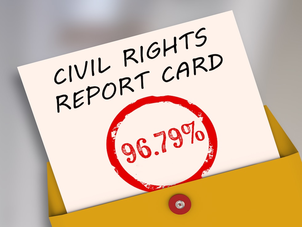 Graphic of a paper coming out of a folder. Text on the paper reads "Civil Rights Report Card" and below that in red font is 96.79% within a red circle.