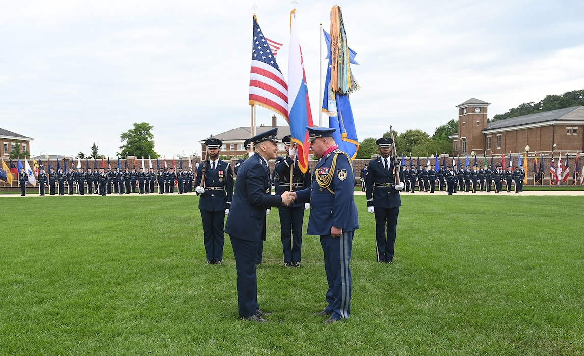 Air Force Chief of Staff Gen. David Allvin presents a medal to Slovak Air Force Commander Maj. Gen. Róbert Tóth during an official welcome ceremony
