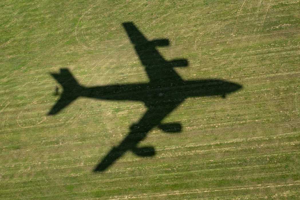 The shadow of a KC-135 Stratotanker from the 121st Air Refueling Wing is cast as it takes off