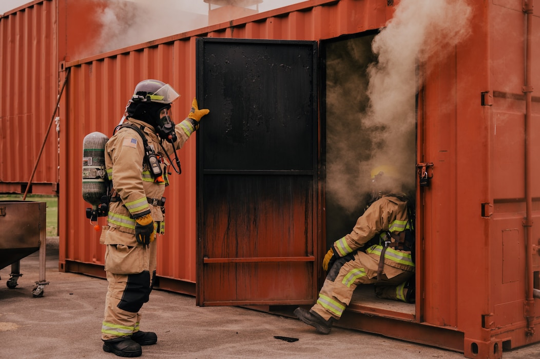 Firefighters from Missouri Air National Guard’s 139th Civil Engineer Squadron's fire and emergency services conduct training in a live-fire simulator