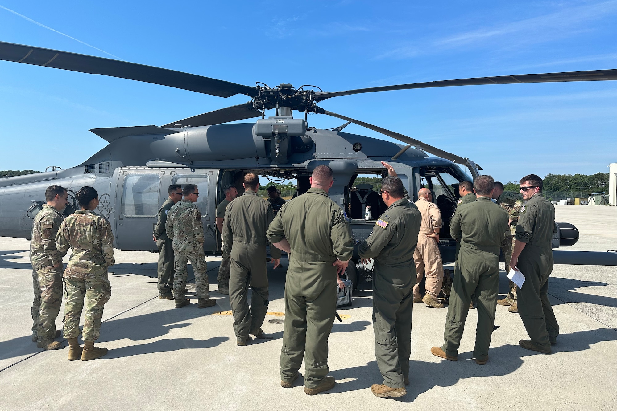 Airmen from the 106th Rescue Wing look at the unit’s first HH-60W Jolly Green II combat search and rescue helicopter to arrive at Francis S. Gabreski Air National Guard Base, Westhampton Beach, N.Y., June 20, 2024. The helicopter was flown by the 41st Rescue Squadron at Moody Air Force Base, Georgia, and marks the beginning of a new era as the 106th transitions from the HH-60G Pave Hawk to the HH-60W.