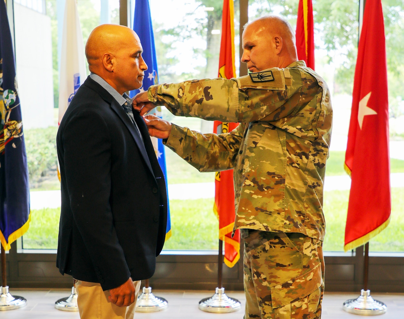 Maj.Gen. Ray Shields, the adjutant general of New York, presents the Bronze Star Medal with “V” device to retired Master Sgt. Luis Barsallo during a ceremony at the New York Division of Military and Naval Affairs headquarters in Latham, New York, June 27, 2024.  Barsallo was recognized for heroism during  combat in Samarra, Iraq, in April and May 2004 in support of Operation Iraqi Freedom.