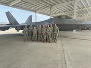 Airmen sent by the 212th Engineering Installation Squadron, Otis Air National Guard Base, Massachusetts, pose during a capabilities tour at Joint Base Langley-Eustis in Virginia. The Airmen performed network infrastructure upgrades at JBLE in May 2024.