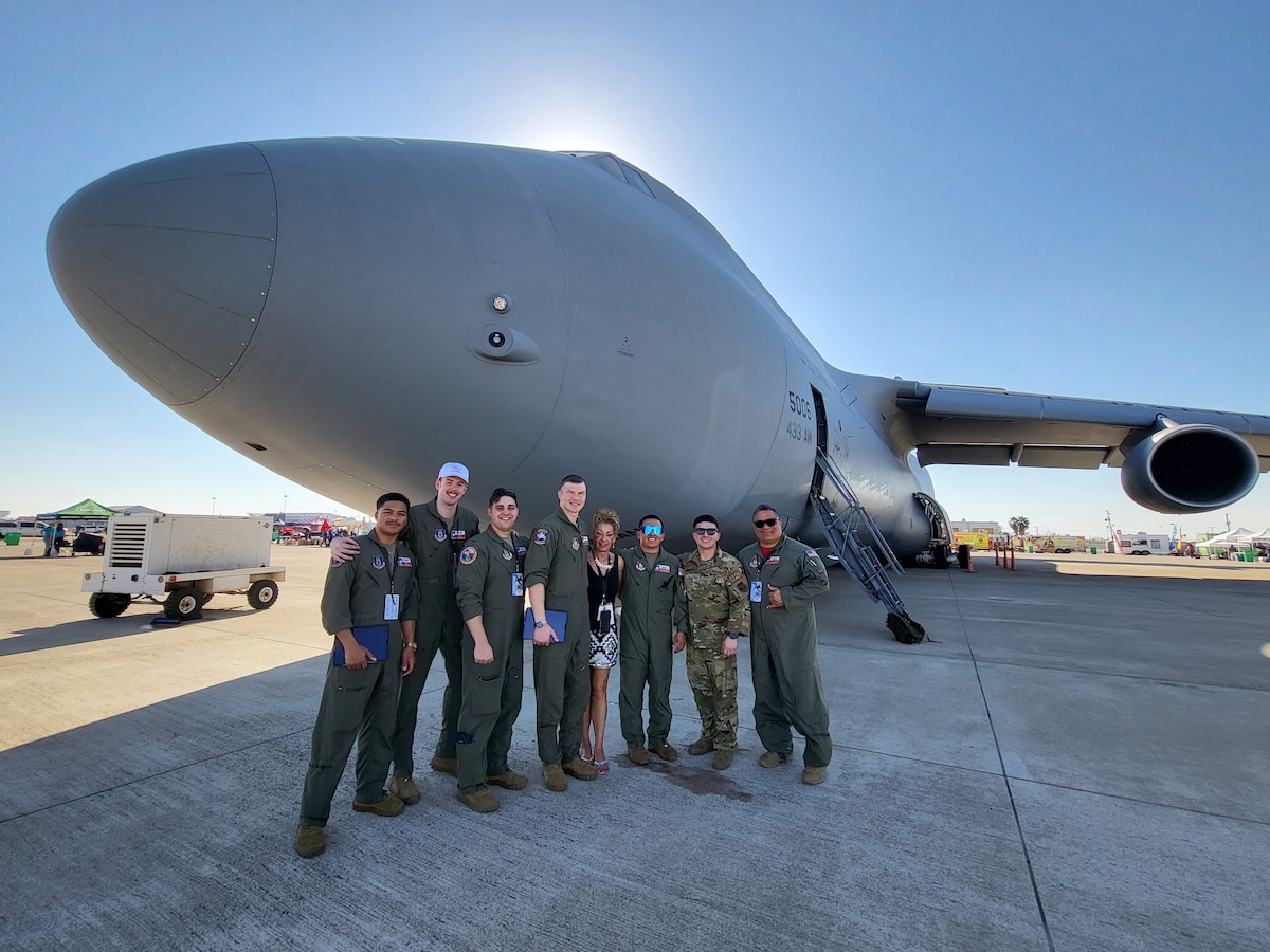 The 68th Airlift Squadron aircrew take a group photo with Laredo community outreach civilian coordinator in front of the C-5M Super Galaxy at the Washington’s Birthday Celebration Association Stars and Stripes Air Show Spectacular on the flightline at the Laredo International Airport in Laredo, Texas Feb. 25, 2024.